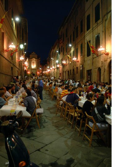 Outdoor dining in a paseo at night in Sienna, Spain